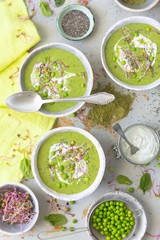 Green vegetable cream soup with peas, spinach and courgette