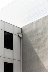 Modern minimal concrete corner on summers day.