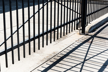 Metal gate protecting open concrete space.