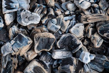 Background consists of glowing hot ebony wood. charcoal