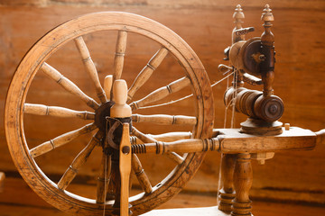 Oldfashioned wooden distaff, spindle, spinning wheel