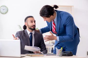 Two male colleagues in the office 