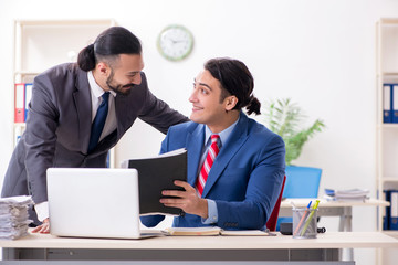 Two male colleagues in the office 