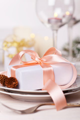 Serving festive table with gift box