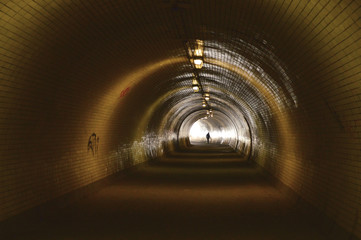 Silhouette of a man in a tunnel situated between Zizkov and Karlin districts in Prague, Czech republic