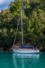 Close view of sailboat in the colorful bay of Portofino in Liguria region, Italy
