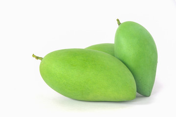 green mangos on a white background