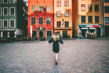 Woman tourist walking in Stockholm travel sightseeing Gamla Stan Stortorget architecture lifestyle...