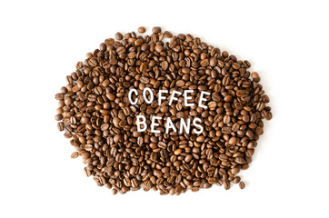 Coffee beans on white background with white inscription in middle.