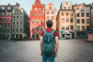 Man tourist walking in Stockholm travel sightseeing Gamla Stan Stortorget architecture lifestyle...