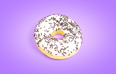 Sweet white donut isolated on violet background