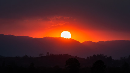 colorful sunset over the mountain at the borderdtown Mae Sot, Tak, Thailand