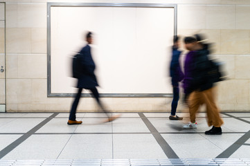 picture of people walking on a street in the city, with camera made motion blur effect