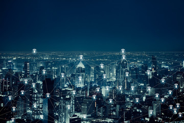 The abstract image of wireless network and wifi connection technology concept with bangkok city background at night in Thailand