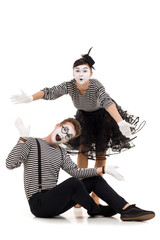 surprised mimes in striped shirts isolated on white background