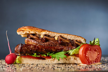 big giant sandwich witch grilled pork ribs in ciabatta.