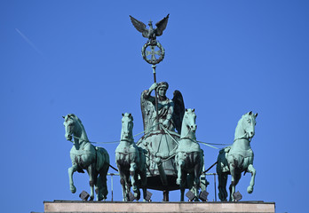 statue of winged victory with quadriga over the Brandeburg gate in Berlin © superpapero