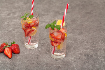 Refreshing Ice Cold Strawberry Lemonade on grey table
