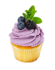 Cupcake with fresh blackberry, blueberries and mint
