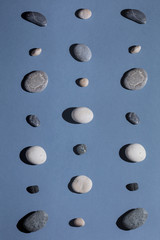 Geometric composition of different stones, top view photo.