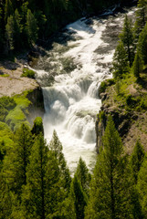 Fototapeta na wymiar Wild Idaho river flows over a large water fall