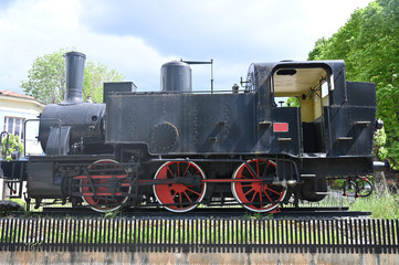 side view of an antique steam locomotive