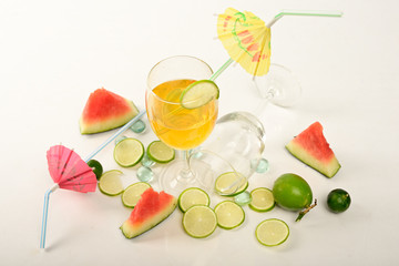Watermelon, pieces of lemon on white background for preparing cool drinks.