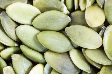 Fototapeta premium Macro close up of fresh pepitas pumpkin seeds.