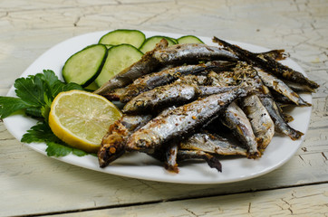 Pan-fried spiced sprats with a cucumber salad