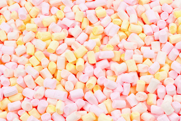 Marshmallow. Background of pink and yellow colorful mini marshmallows.