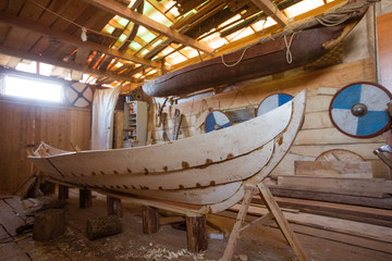 Wooden boat in the barn