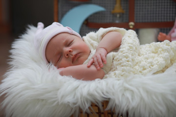 Baby newborn sleeping wrapped up in a blanket