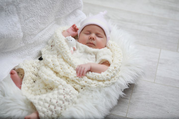 Baby newborn sleeping wrapped up in a blanket