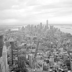 Foto op Plexiglas View of Lower Manhattan from the top of Empire State Building. Scanned film photo. Scanned black and white film photo. Captured with a medium format SLR camera from 1960s. © berezko