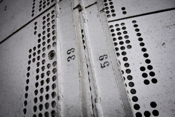 Close-up of a punch card, from antique weaving loom, remain of the past , when the city of Sedan, France, was a well known for mastering manufacturing arts