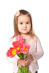 Girl with spring tulips bouquet isolated over white