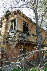 Old abandoned and destroyed log house in Russia. Abandoned house in the middle of the forest