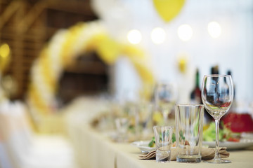 Glasses on the table in the restaurant. Table setting.