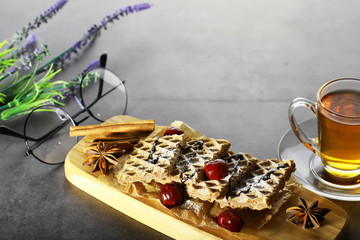 Sweet dessert with waffles and berries for tea at work.