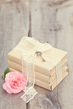 Vintage image with old books on wooden background