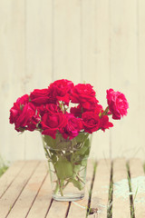 Vintage image of red roses bouqet outdoor