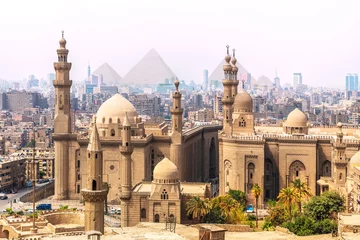Foto op Canvas The Mosque-Madrassa of Sultan Hassan and the Pyramids in the background, Cairo, Egypt © AlexAnton