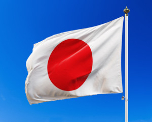 Flag of Japan on the blue sky. Isolated with clipping path.
