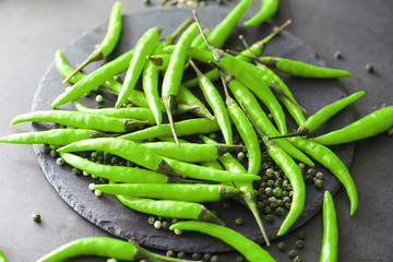Hot green pepper. Chilean pepper on a black.