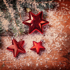 Christmas red stars on wooden background