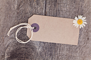 Blanket ecotag on wooden background