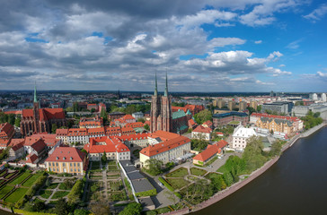 Fototapeta na wymiar The aerial view of Wroclaw: Ostrow Tumski, Cathedral of St. John the Baptist and Collegiate Church of the Holy Cross and St. Bartholomew 