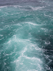 Fototapeta na wymiar Water wave tail from ferry boat, Bergen Norway