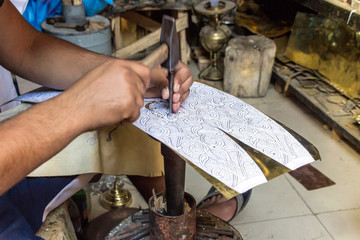 metal handcraft man making lamp at store in morocco 