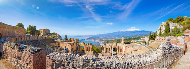 Panoramic view of ruins of Ancient Greek theatre in Taormina on background of Etna Volcano, Italy. - obrazy, fototapety, plakaty